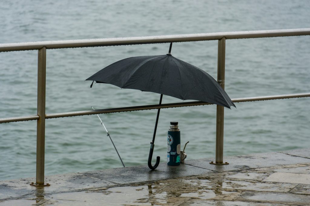 Rain in Lisbon and Umbrella on the floor 