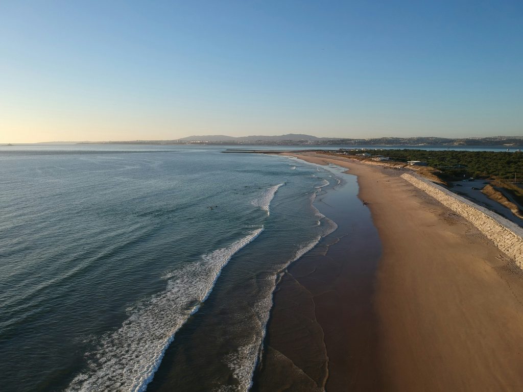 Costa da Caparica Coastline. Beautiful view with sunset, but there may hidden be dangers in Portuguese beaches