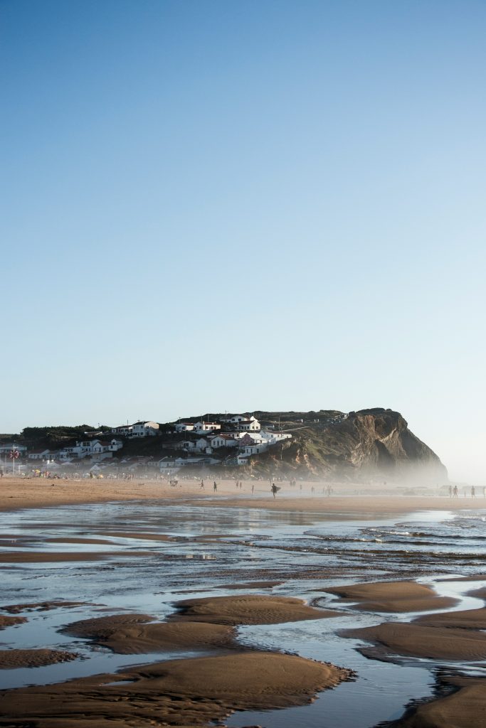 Monte Clérigo Beach with white houses in the distance, best beach in Europe 2026